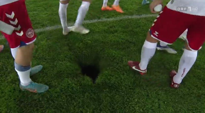 Bizarre sinkhole appears on the pitch during Denmark vs Austria clash