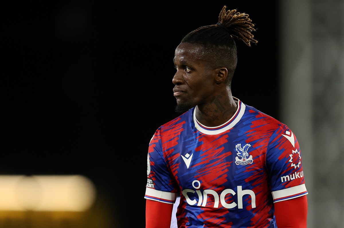 Crystal Palace's Wilfried Zaha removes his shirt as he leave the pitch  following the English Premier League soccer match between Crystal Palace  and Manchester City at Selhurst Park in London, England, Saturday