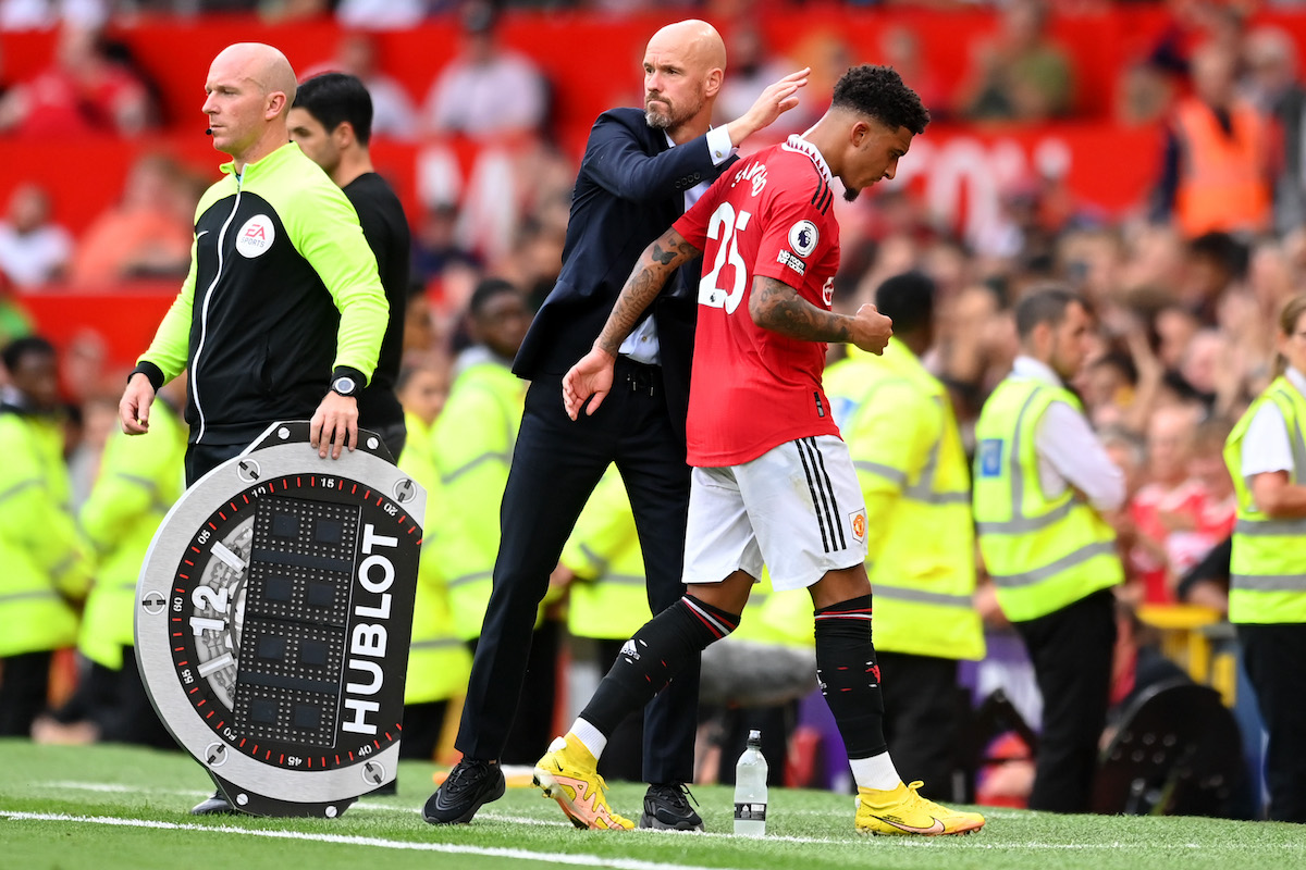 Jadon Sancho walks past Manchester United boss Erik Ten Hag.