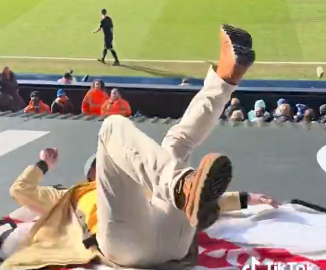 Video: Maidstone United fan rolls over and falls from the top-tier stand during wild celebrations
