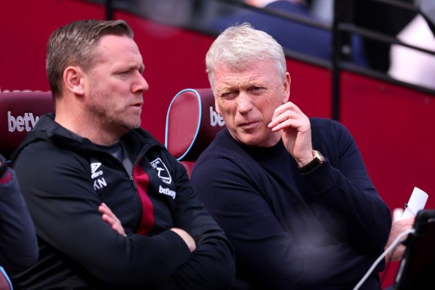 David Moyes, Manager of West Ham United, interacts with Kevin Nolan coa prior to the Premier League match between West Ham United and Fulham FC at London Stadium on April 14, 2024 in London, England.