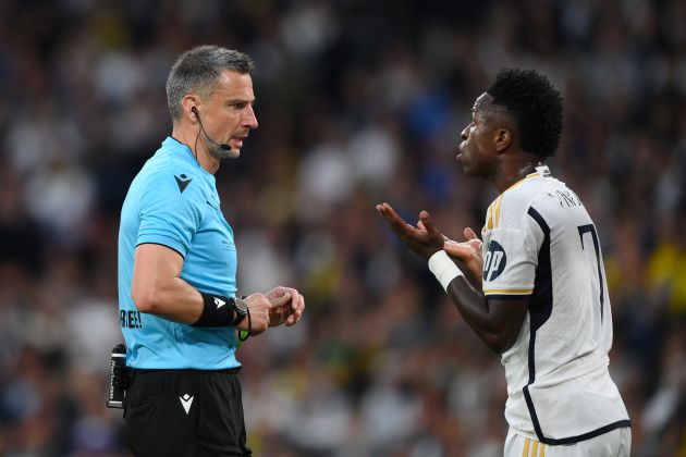 Real Madrid forward Vinicius Junior pictured (right) complaining to referee Slavko Vincic during the 2024 UEFA Champions League final