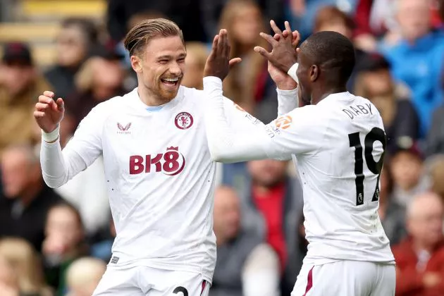 Matty Cash of Aston Villa celebrates with ava19after scoring the team's second goal during the Premier League match between Burnley FC and Aston Villa at Turf Moor on August 27, 2023.