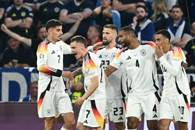 Germany's midfielder #17 Florian Wirtz (2nd L) celebrates with teammates after scoring his team's first goal during the UEFA Euro 2024 Group A football match between Germany and Scotland at the Munich Football Arena in Munich on June 14, 2024.