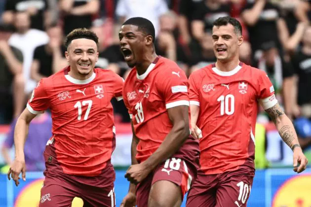 Kwadwo Duah (C) celebrates scoring the opening goal with his teammates midfielder #10 Granit Xhaka (R) and midfielder #17 Ruben Vargas during the UEFA Euro 2024 Group A football match between Hungary and Switzerland at the Cologne Stadium in Cologne on June 15, 2024.