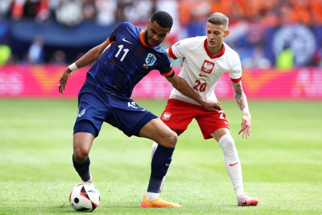 Netherlands' forward #11 Cody Gakpo (L) fights for the ball with Poland's midfielder #20 Sebastian Szymanski during the UEFA Euro 2024 Group D football match between Poland and the Netherlands at the Volksparkstadion in Hamburg on June 16, 2024.