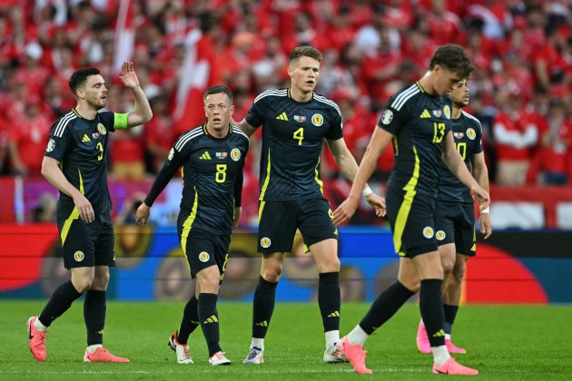 Scotland's midfielder #04 Scott McTominay (C) celebrates with teammates after scoring his team's first goal during the UEFA Euro 2024 Group A football match between Scotland and Switzerland at the Cologne Stadium in Cologne on June 19, 2024.