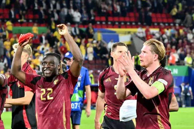 Belgium's forward #22 Jeremy Doku (L) and Belgium's midfielder #07 Kevin De Bruyne celebrate after winning the UEFA Euro 2024 Group E football match between Belgium and Romania at the Cologne Stadium in Cologne on June 22, 2024.
