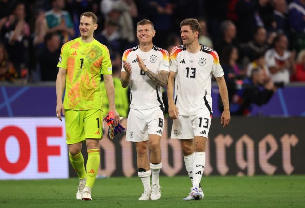 Manuel Neuer, Toni Kroos and Thomas Mueller of Germany celebrate at full-time following the team's victory in the UEFA EURO 2024 group stage match between Germany and Scotland at Munich Football Arena on June 14, 2024 in Munich, Germany.