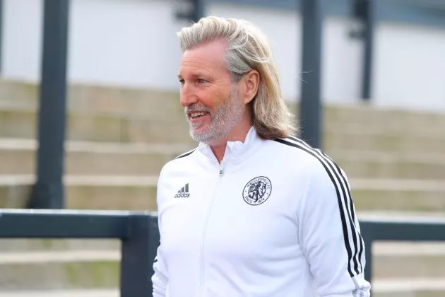 Robbie Savage, owner of Macclesfield FC, looks on prior to the North West Counties Football League match between Macclesfield FC and AFC Liverpool at Leasing.com Stadium on April 02, 2022 in Macclesfield, England.