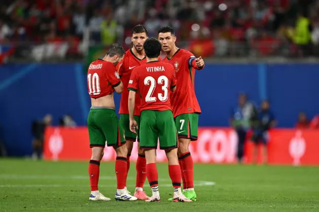 Cristiano Ronaldo of Portugal speaks with teammates Bernardo Silva, Ruben Dias and Vitinha during the UEFA EURO 2024 group stage match between Portugal and Czechia at Football Stadium Leipzig on June 18, 2024 in Leipzig, Germany.