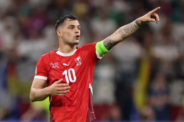 Granit Xhaka of Switzerland reacts during the UEFA EURO 2024 group stage match between Switzerland and Germany at Frankfurt Arena on June 23, 2024 in Frankfurt am Main, Germany.