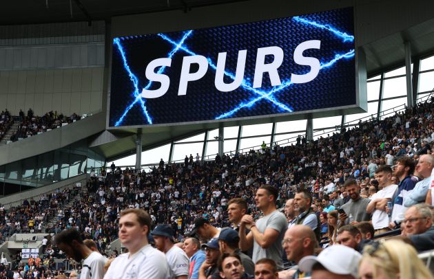 A photo of a group of fans inside the Tottenham Hotspur Stadium