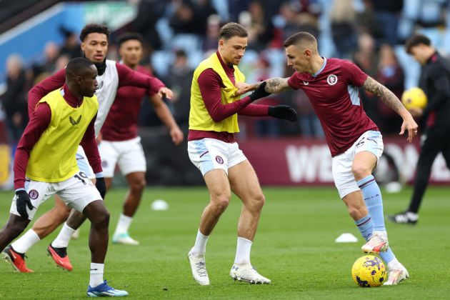 Matty Cash and Lucas Digne of Aston Villa warm up prior to the Premier League match between Aston Villa and Fulham FC at Villa Park on November 12, 2023 in Birmingham, England.