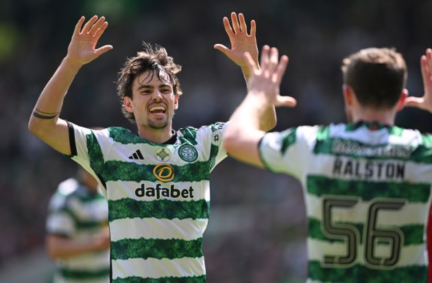 Matt O' Riley (l) of Celtic celebrates the winning Celtic goal with team mate Anthony Ralston during the Cinch Scottish Premiership match between Celtic FC v St Mirren at Celtic Park Stadium on May 18, 2024 in Glasgow, Scotland.