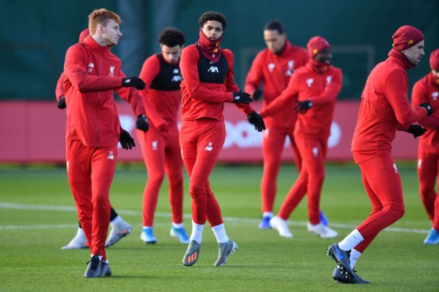 Sepp van den Berg (L) and Liverpool's Dutch defender Ki-Jana Hoever (C) attend a training session at Melwood in Liverpool, north west England on December 9, 2019, on the eve of their UEFA Champions League Group E football match against Salzburg.