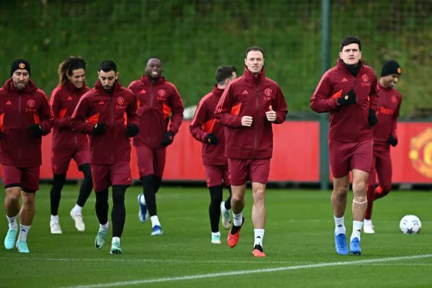 Jonny Evans (C) and Manchester United's English defender #05 Harry Maguire (R) take part with teammates in a training session at the Carrington Training Complex in Manchester, north-west England on November 7, 2023