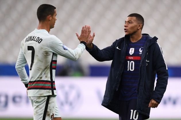 Portugal's forward Cristiano Ronaldo (L) greets France's forward Kylian Mbappe at the end of the Nations League football match between France and Portugal, on October 11, 2020 at the Stade de France in Saint-Denis, outside Paris.