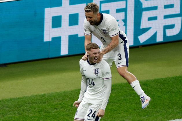 ngland's midfielder #24 Cole Palmer celebrates with England's defender #03 Luke Shaw after scoring his team's first goal during the UEFA Euro 2024 final football match between Spain and England at the Olympiastadion in Berlin on July 14, 2024.