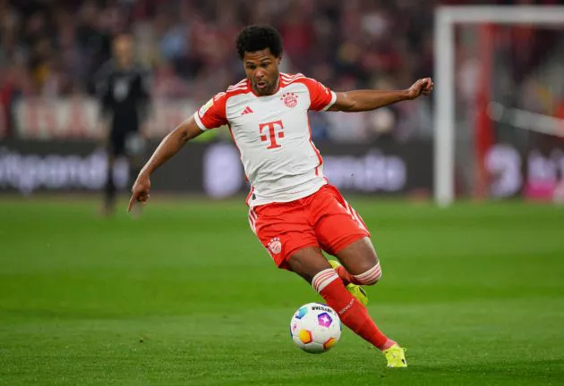 Serge Gnabry of Bayern Munich controls the ball during the Bundesliga match between FC Bayern München and Borussia Dortmund at Allianz Arena on March 30, 2024 in Munich, Germany.