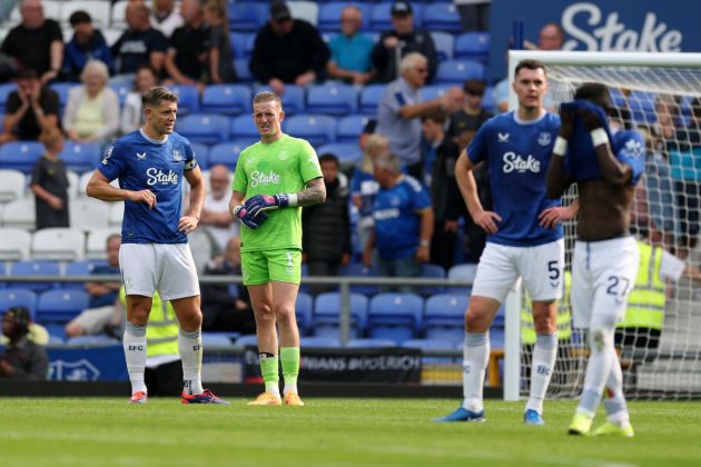 James Tarkowski and Jordan Pickford of Everton reac during the Premier League match between Everton FC and Brighton & Hove Albion FC at Goodison Park on August 17, 2024 in Liverpool, England.