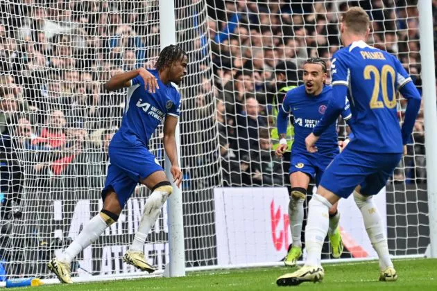 Chelsea's English midfielder #17 Carney Chukwuemeka (L) celebrates after scoring their third goal during the English FA Cup Quarter Final football match between Chelsea and Leicester City at Stamford Bridge in London on March 17, 2024.