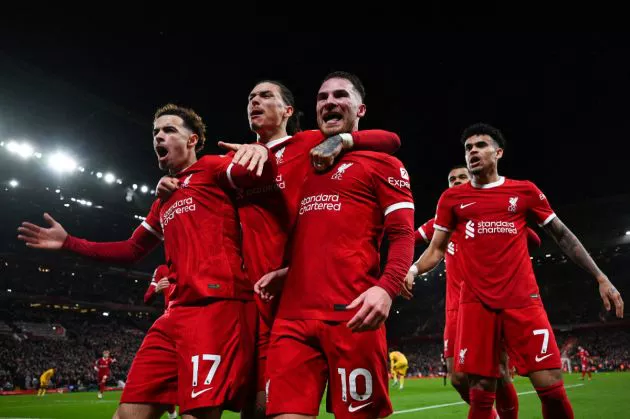 Liverpool's Argentinian midfielder #10 Alexis Mac Allister (R) celebrates with Liverpool's Uruguayan striker #09 Darwin Nunez (C) and Liverpool's English midfielder #17 Curtis Jones (L) after scoring his team second goal during the English Premier League football match between Liverpool and Sheffield United at Anfield in Liverpool, north west England on April 4, 2024.