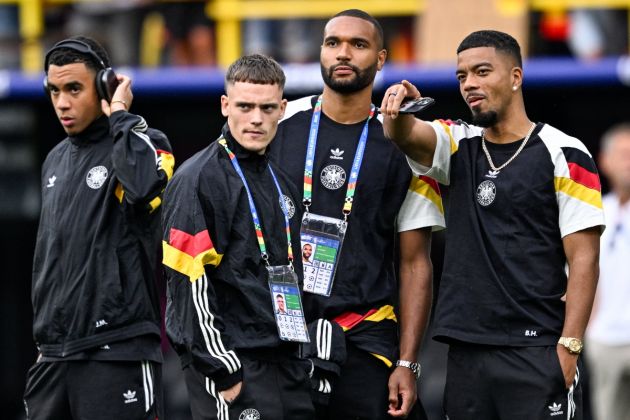 Germany's midfielder #10 Jamal Musiala, Germany's midfielder #17 Florian Wirtz, Germany's defender #04 Jonathan Tah and Germany's defender #20 Benjamin Henrichs check the pitch prior to the UEFA Euro 2024 round of 16 football match between Germany and Denmark at the BVB Stadion Dortmund in Dortmund on June 29, 2024.