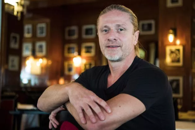 Former French midfielder and 1998 World Champion, Emmanuel Petit poses during a photo session on September 14, 2017