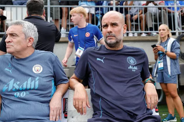 Manchester City's Spanish manager Pep Guardiola looks on from the bench before the pre-season club friendly football match between Manchester City and Chelsea at Ohio Stadium in Columbus, Ohio, August 3, 2024.