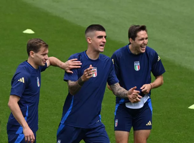 Nicolo Barella, Gianluca Mancini and Federico Chiesa of Italy in action during the Italy training session at Hemberg-Stadion on June 28, 2024 in Iserlohn, Germany.