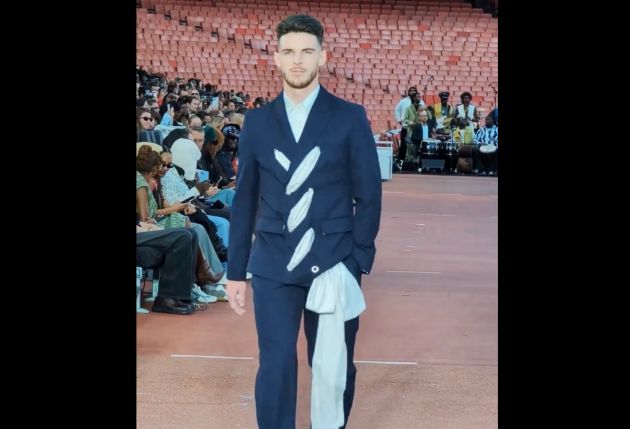 Arsenal's Declan Rice sashays down the catwalk during a fashion parade at the Emirates Stadium