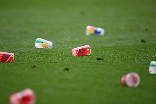 Empty beer glasses lays on the pitch during the UEFA Euro 2024 Group C football match between Slovenia and Serbia at the Munich Football Arena in Munich, southern Germany, on June 20, 2024.