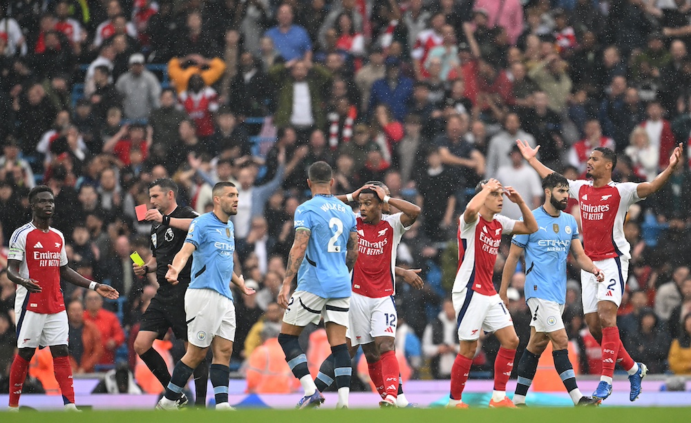 Arsenal were forced to play defensively against Manchester City after Leandro Trossard was sent off.