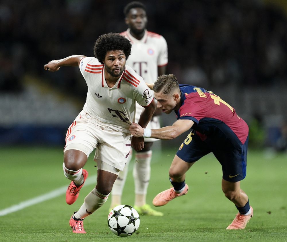 Fermin Lopez (right) wrestles with Serge Gnabry (left) in the Champions League.