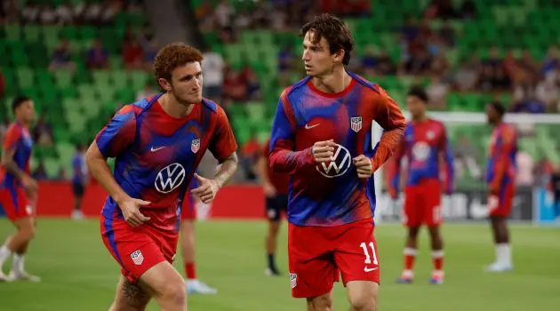 Brenden Aaronson and Josh Sargent warm up