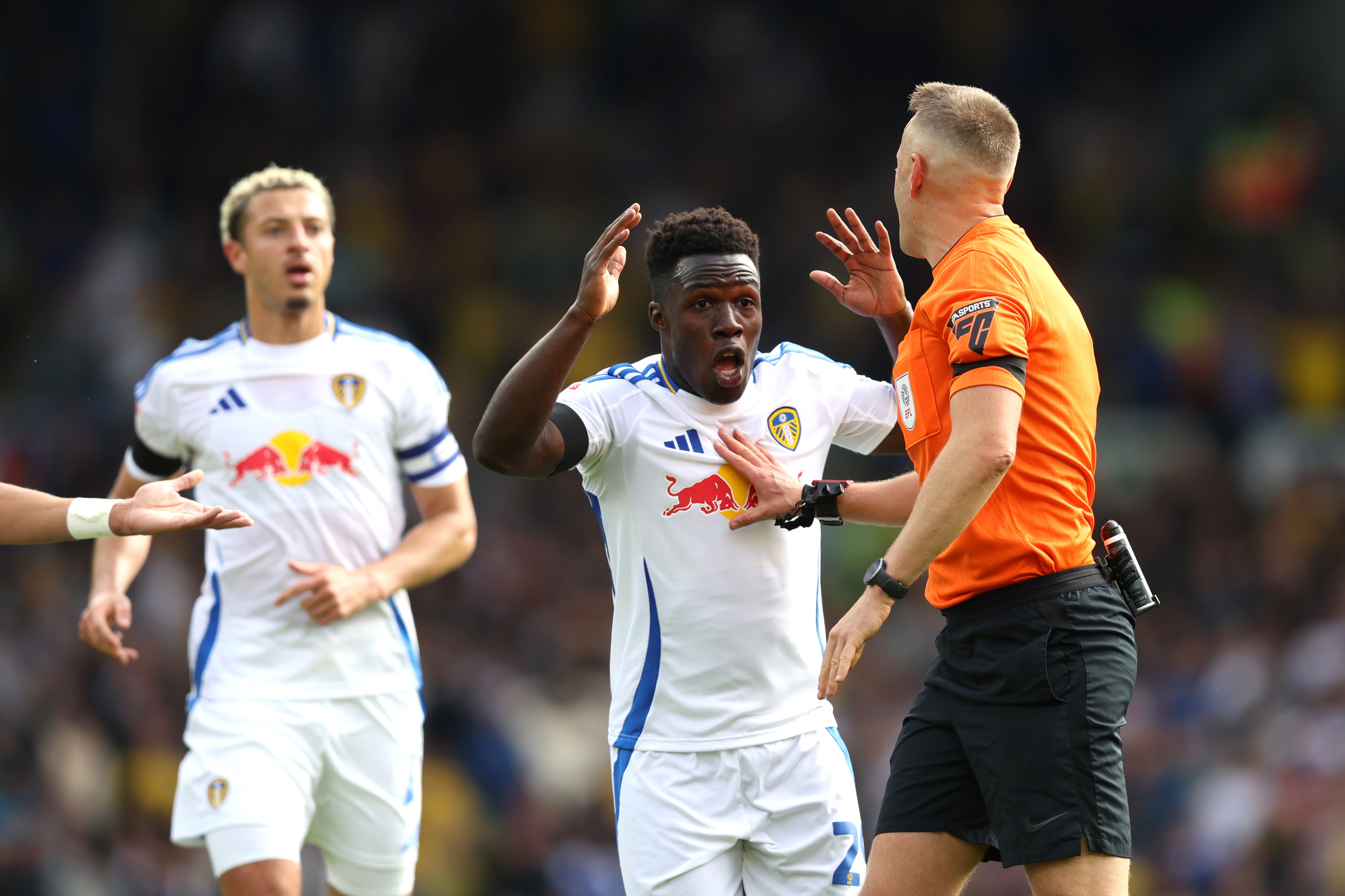 Leeds' Willy Gnonto argues with an official