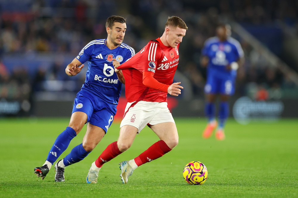 Harry Winks (left) and Elliot Anderson (right) vying for the ball during Leicester City vs. Nottingham Forest.