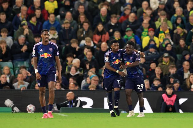 NORWICH, ENGLAND - OCTOBER 01: Largie Ramazani of Leeds United (C) celebrates scoring his team's first goal with teammate Wilfried Gnonto (R) during the Sky Bet Championship match between Norwich City FC and Leeds United FC at Carrow Road on October 01, 2024 in Norwich, England.