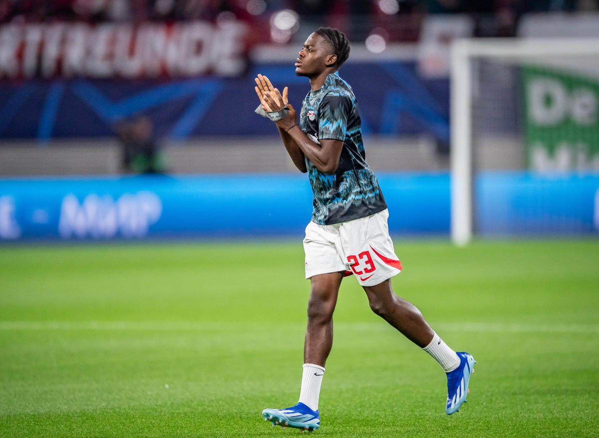 Castello Lukeba applauds the RB Leipzig fans during his pre-match warmup