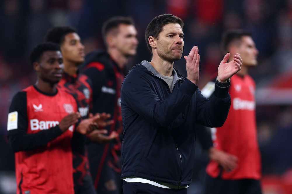 Xabi Alonso celebrating victory with Bayer Leverkusen.