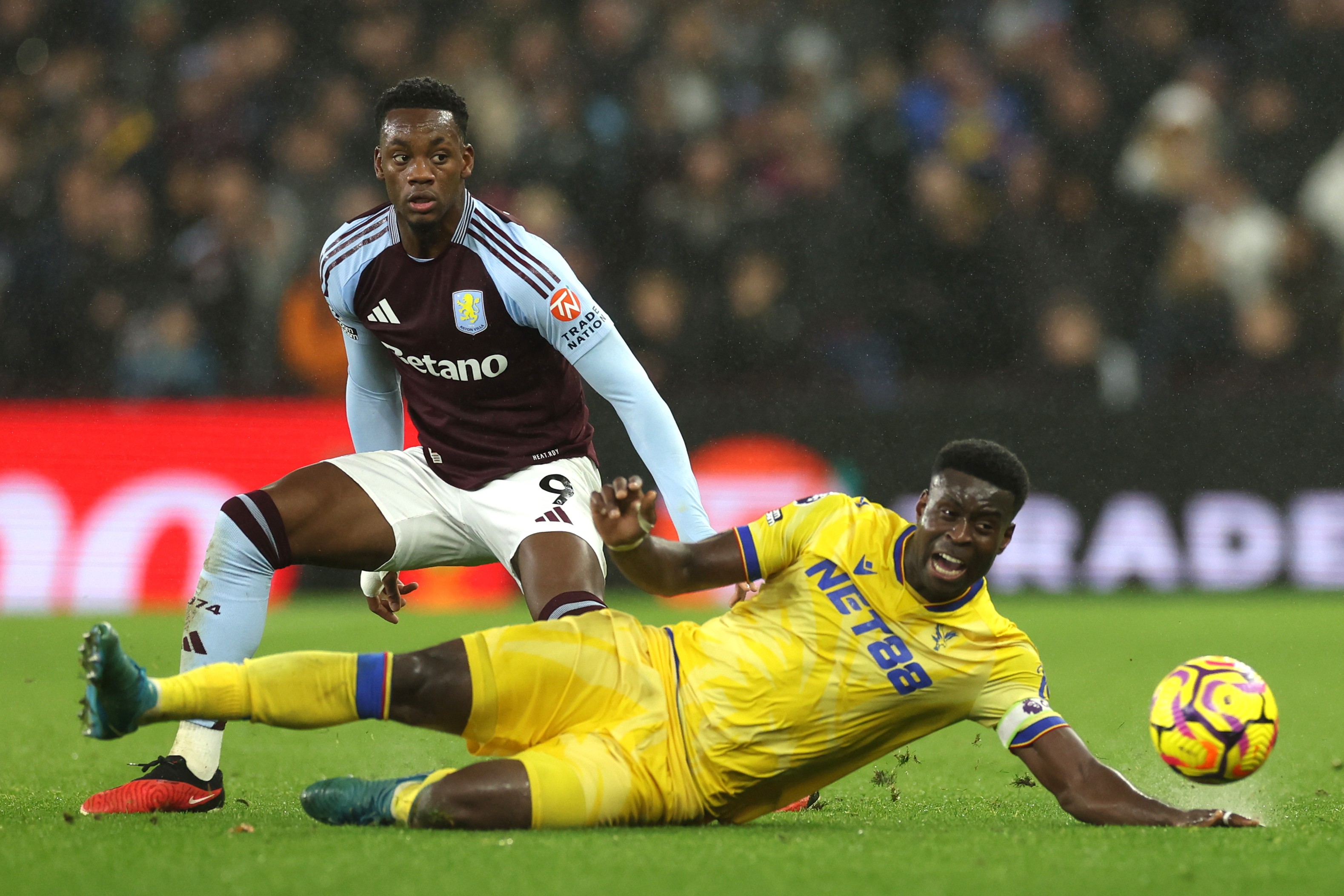 Jhon Duran of Aston Villa is challenged by Marc Guehi of Crystal Palace