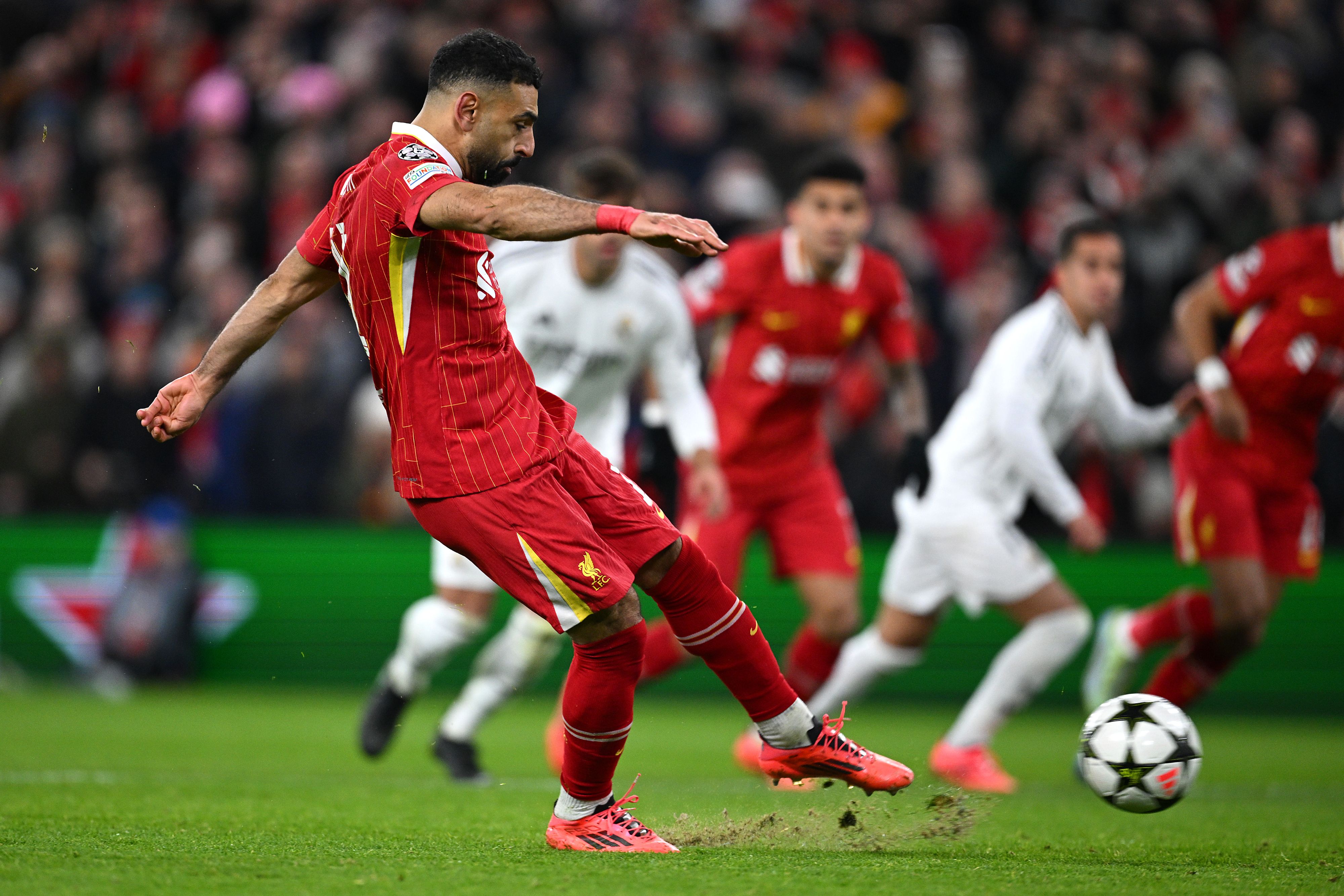 Mohamed Salah of Liverpool takes a penalty