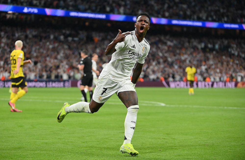 Vini Jr celebrating scoring for Real Madrid against Borussia Dortmund in the Champions League.