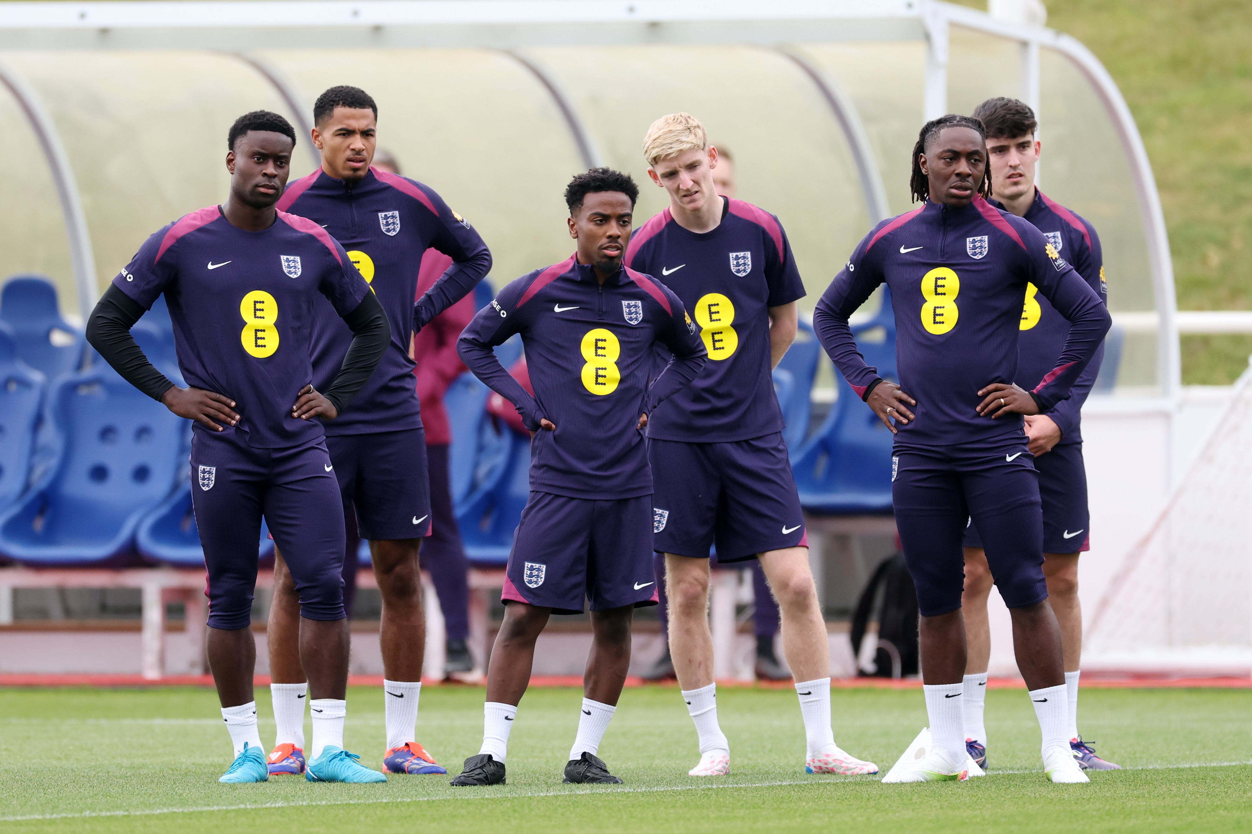 Players of England look on during a training session