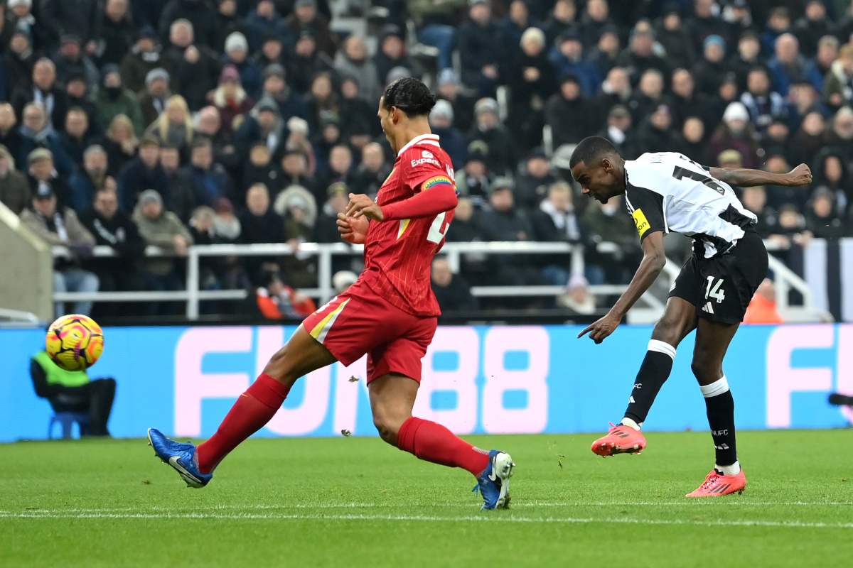 Alexander Isak turns Liverpool's Virgil van Dijk.