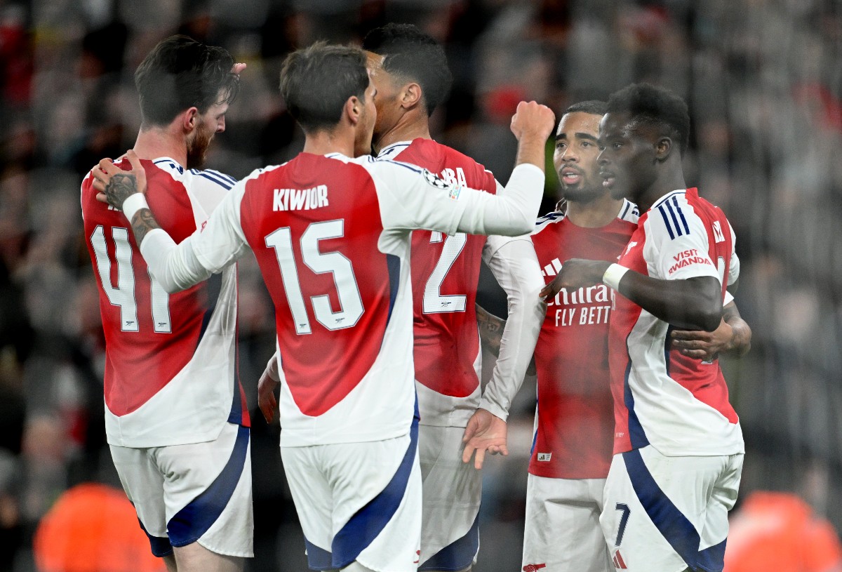 Arsenal players celebrate during their 3-0 win vs Monaco