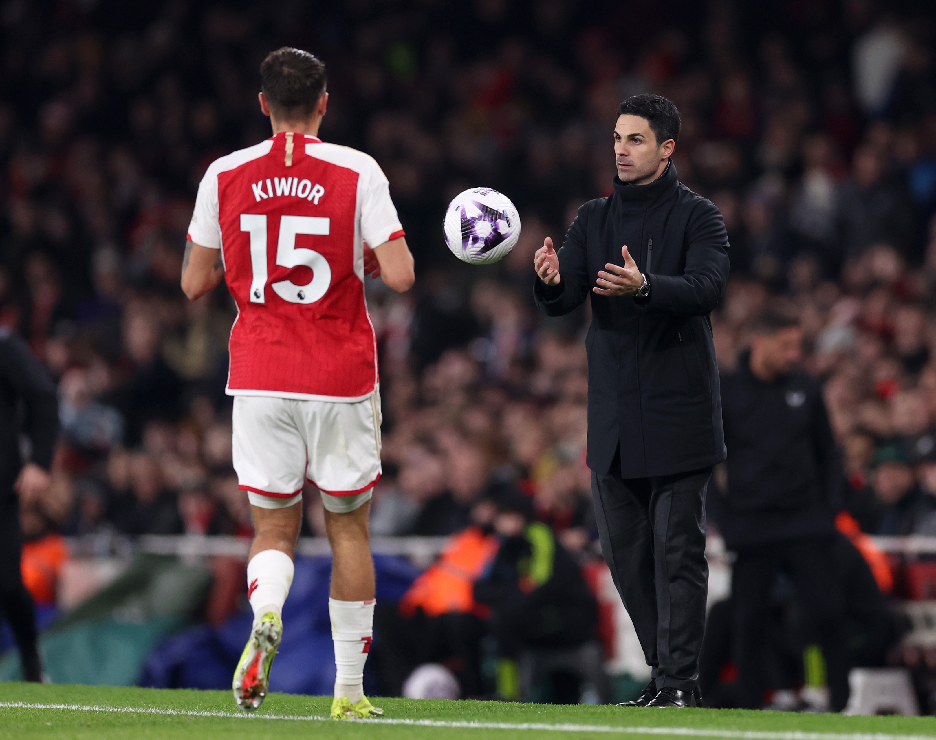 Jakub Kiwior and Mikel Arteta of Arsenal