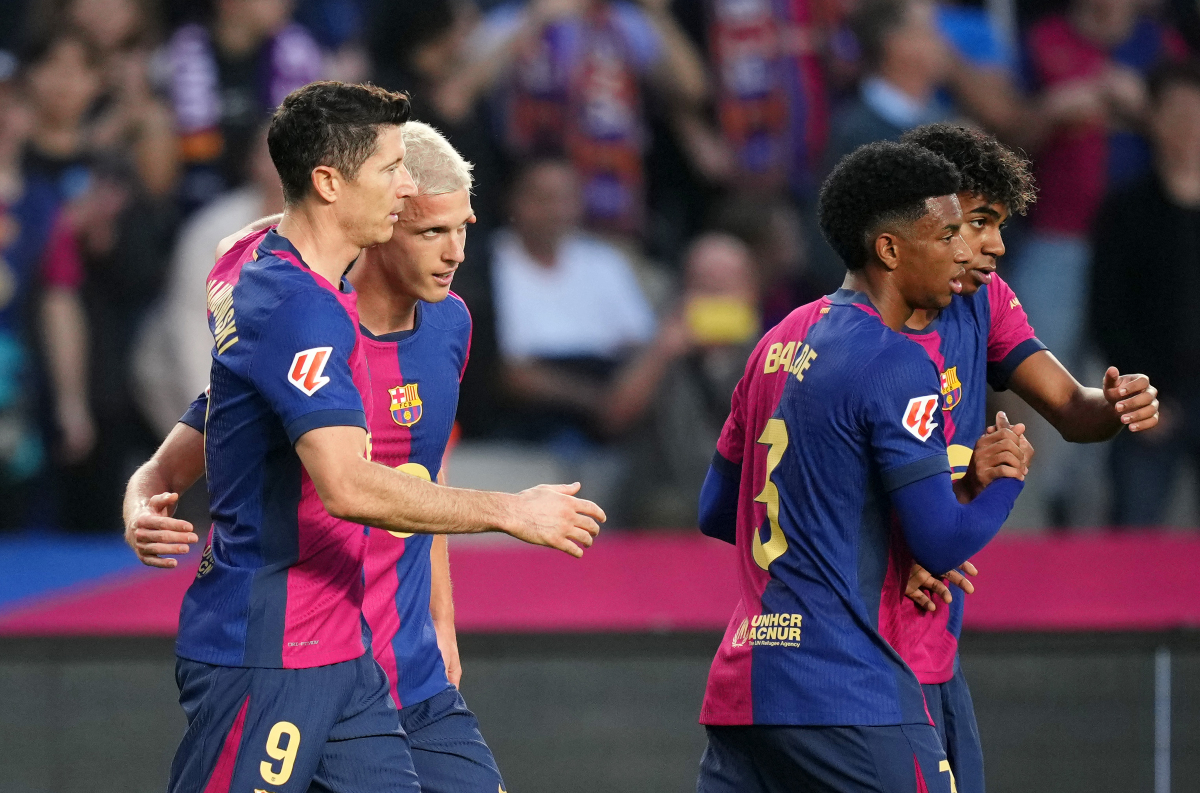 Dani Olmo celebrates with his Barcelona teammates