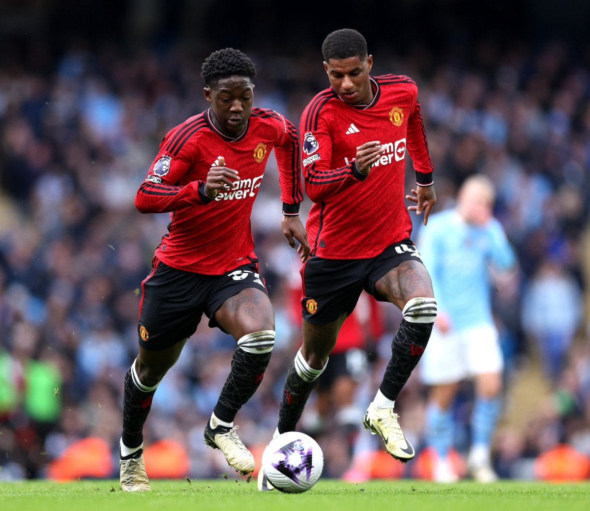 Kobbie Mainoo and Marcus Rashford in action for Manchester United